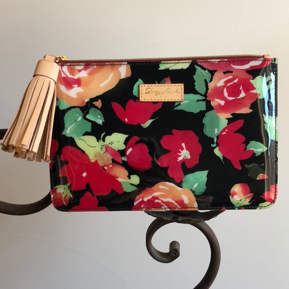 Dooney & Bourke Floral clutch with Leather Tassel.